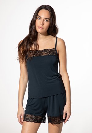 Black lounge set featuring a tank top with a lace trim and matching shorts with lace accents, made from soft, stretchy fabric.