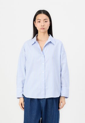 Striped button-up shirt in light blue and white, featuring a collar, long sleeves, and a relaxed fit with a smooth cotton texture.