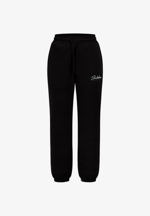 Pantalons de survêtement noirs en tissu en coton doux, dotés d'une taille élastique avec cordon de serrage, d'anses resserrées aux chevilles et d'un logo blanc sur le devant.