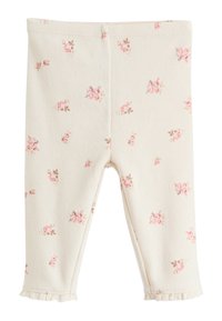 Colanți din bumbac ușor cu bază crem, având un model mic de trandafiri, textură nervurată și tiv plisat la glezne.