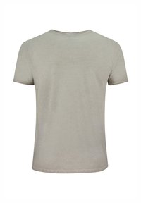 Camiseta de manga corta color beige claro con cuello redondo, hecha de una tela suave, que presenta una textura sutil y sin logotipos ni patrones visibles.