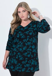 Schwarzes Langarm-Tunikashirt mit V-Ausschnitt, versehen mit einem floralen Muster in Türkis. Glattes Material und lockere Passform, die bis zur Mitte des Oberschenkels reicht.