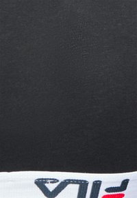 Lingerie en tissu extensible noir avec une taille blanche présentant des accents de logo bleu marine et rouge. Texture lisse avec un ajustement serré.