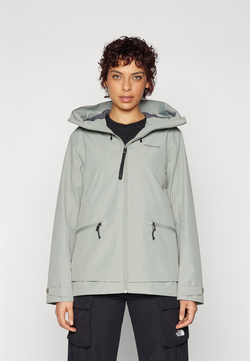 Light grey waterproof jacket with a hood, featuring a front zipper, adjustable cord, two zippered pockets, and elastic cuffs.