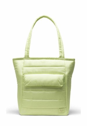 Sac cabas matelassé vert clair avec de longues anses, doté d'une poche avant et d'une texture lisse et douce. Lignes de couture visibles sur le corps.