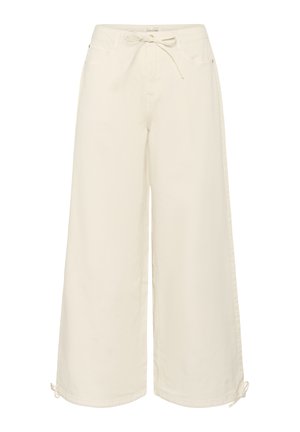 Pantalons larges en tissu blanc cassé, avec une taille à cordon de serrage, des poches latérales et des détails à nouer réglables à l'ourlet.
