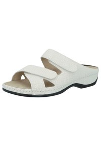 White slide sandal with two adjustable Velcro straps. Textured surface, round open toe, and synthetic sole for comfort. Low-profile design.