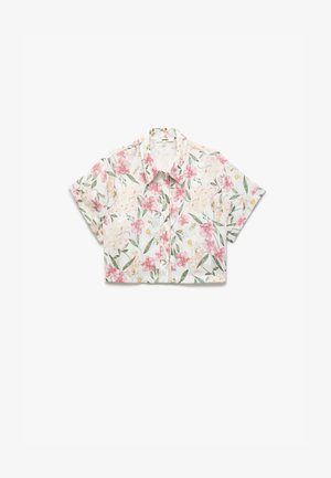 Przykrótka koszula z lekkiego materiału, zdobiona kwiatowym wzorem w różowe i żółte kwiaty na białym tle. Zapięcie na guziki z przodu.