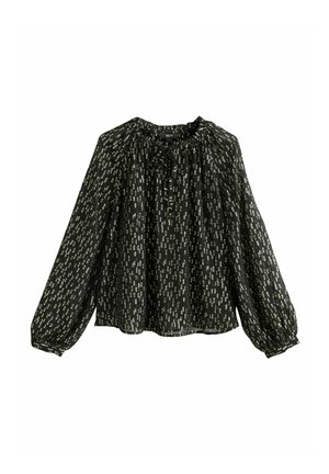 Blouse noire à manches longues avec motif abstrait argenté, encolure froncée et poignets élastiques, présentée sur fond blanc.