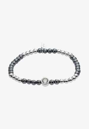Bracelet extensible avec des perles argentées et facettées gris foncé alternées et une pierre précieuse ronde et claire centrale sertie en argent.