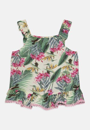 Top sin mangas con estampado floral en tejido ligero, que presenta orquídeas rosas y hojas verdes. Dobladillo con volantes y borde de pompón rosa. Tirantes con volantes.