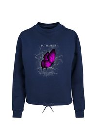 Felpa blu navy con maniche lunghe, orlo con coulisse e grafica di una farfalla in viola con il testo "FARFALLE" sopra. Tessuto in superficie liscia.