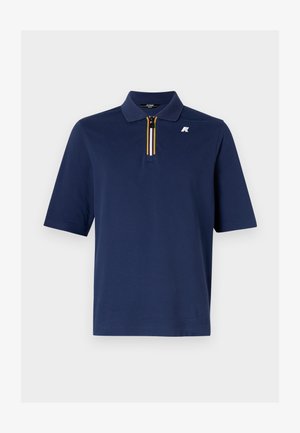 Námornícky polo tričko z bavlny s krátkym zipsom a detailom pruhov v žltej, bielej a čiernej farbe. Na hrudi sa nachádza malé logo.