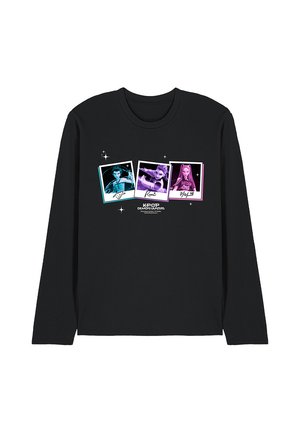 Black long-sleeve shirt with three colorful stylized character portraits labeled Kyo, Kumi, and Byul above the text "K-Pop Demon Hunters."