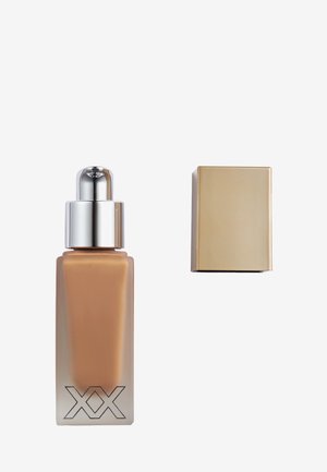 XX REVOLUTION SKIN GLOW TINTED BOOSTER - Bronzer - heat