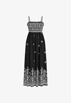 Abito lungo nero senza maniche con ricamo floreale bianco sul corpetto, fiori sparsi sulla gonna e motivo dettagliato sul bordo dell'orlo.