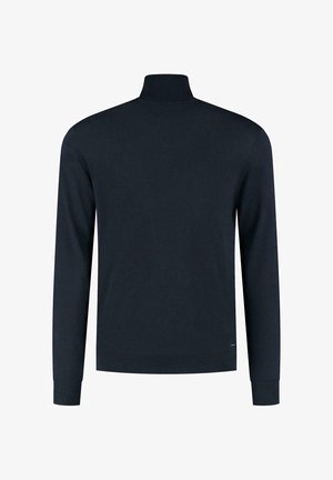 Jūras spēku zila pulovera jaka ar garām piedurknēm un augstu kaklu. Gluda tekstūra ar ribinātiem aprocēm un apakšmalu. Bez rakstiem vai redzamiem detaļām.