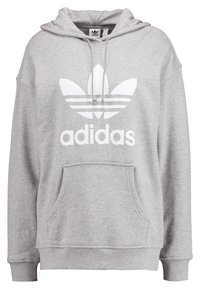 Šedá mikina s kapucí z bavlněné směsi, vybavená přední klokánkovou kapsou, žebrovanými manžetami a bílým logem Adidas na přední straně.