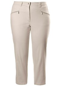 Pantalons beige clair avec une coupe slim, dotés d'une poche zippée, de passants de ceinture et d'un ourlet retroussé. Confectionnés dans un tissu lisse et extensible.