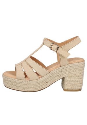 Sandalias de plataforma beige con tacón de yute trenzado, que presentan un diseño de tira en forma de T, recortes y una hebilla ajustable en el tobillo. Suela de texturizada suave.