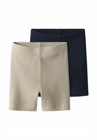 Deux paires de shorts côtelés, l'une beige et l'autre marine. Les deux présentent une texture douce et une taille élastique pour plus de confort.