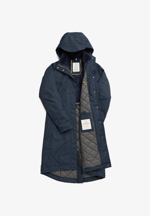 Cappotto impermeabile navy con fodera grigia trapuntata, cappuccio e dettagli gialli; presenta chiusure a scatto e un'etichetta del marchio all'interno.