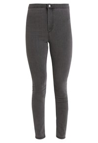 Jeans ajustados de cintura alta en denim gris oscuro con una textura suave y un cierre frontal de botón único. Presentan un detalle minimalista y piernas ajustadas.