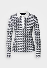 Langarm poloshirt met een hounds-tooth patroon in marineblauw en wit. Voorzien van een witte kraag en knoopsluiting, gemaakt van een gladde stof.