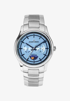 Sølv metal armbåndsur med lys blå urskive, sorte timemarkører, underskiver til dag, dato og månefasevisning.