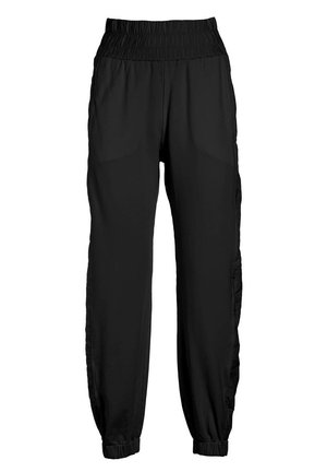 Zwarte sportbroek met een elastische tailleband, zijzakken en taps toelopende boorden voor een ontspannen pasvorm, vervaardigd uit lichte stof.