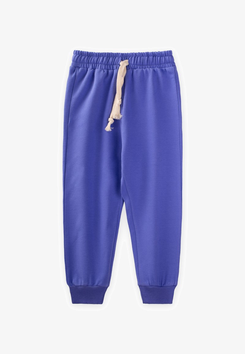 Violetas sporta bikses, izgatavotas no mīkstas auduma, ar elastīgu jostasvietu un krēmveida auklu, kā arī šauriem apaviem potītēs.