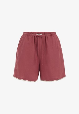 Růžové volnočasové šortky s elastickým pasem, stahovací šňůrkou, postranními kapsami a bílou vlnkovanou lemovkou kolem nohavic.