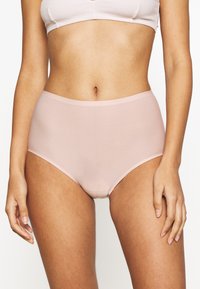 Light pink high-waisted underwear made of smooth fabric, featuring a seamless design with a soft waistband and no visible stitching details.