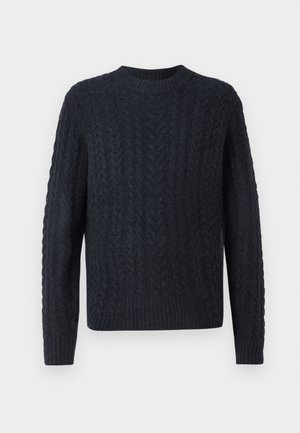 Tummansininen neulottu neule, jossa teksturoitu palmikkokuvio, pyöreä pääntie sekä resorit helmassa ja hihansuissa. Pehmeä kangas, pitkät hihat.