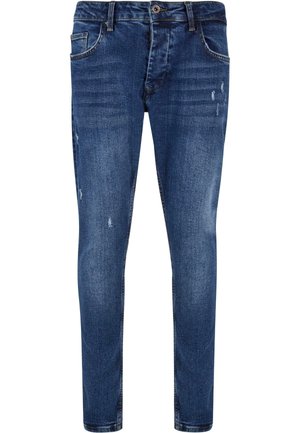 Strakke blauwe denim jeans met een middelhoge taille, voorzien van versleten details, vijf zakken en een rits met knoopsluiting.