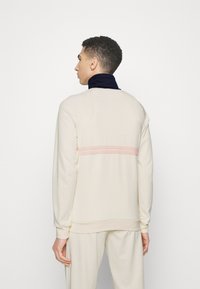 Sergio Tacchini DALLAS TRACK - Jaka ar rāvējslēdzēju - gardenia/maritime blue