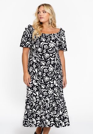 Schwarz-weißes Blumenmuster-Kleid mit kurzen Puffärmeln, quadratischem Ausschnitt und gerafftem Saum, aus leichtem Stoff gefertigt.