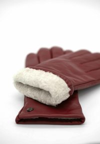 Red leather gloves with a soft white fleece lining at the cuff. Features include a smooth finish and a small black accent at the wrist.