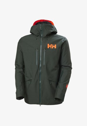 Veste d'extérieur à capuche vert foncé avec logo HH orange, plusieurs poches zippées et poignets ajustables.