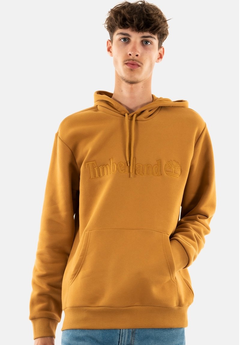 Felpa color senape con tasca frontale e cappuccio con coulisse. Presenta il logo "Timberland" in rilievo. Tessuto morbido e vestibilità comoda.