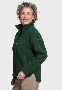 Grüne Fleecejacke mit hohem Kragen, Reißverschluss und Seitentaschen. Weicher Stoff und lässige Passform, mit einem leicht abgerundeten Saum.