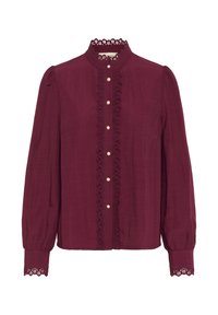 Bordowa bluzka z długimi bufkami, koronkowym wykończeniem dekoltu oraz zapięciem na guziki z perłowymi akcentami z przodu. Miękka struktura.