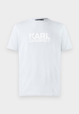 Világoskék, rövid ujjú pamut póló, kerek nyakkal, elöl nagy fehér felirattal: "KARL LAGERFELD". Sima textúra.