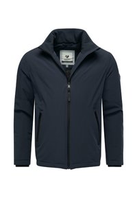 Tamsiai mėlyna striukė su aukštu apykakliu, visiškai užtraukiama priekyje, dviem šoninėmis kišenėmis ir lygiu paviršiumi. Ant vidinės etiketės yra logotipo etiketas.