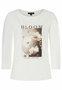 Witte lange mouwen t-shirt met een bloemenontwerp en de tekst "BLOOM" en "autumn bloom" in het zwart. Glad katoenen stof.