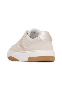Tan suede slip-on sneaker with woven texture, white sole, and a gum rubber outsole. Metallic accent on the heel adds detail.