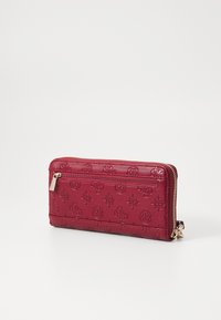 Guess GERTY LARGE ZIP AROUND - Portefeuille - claret