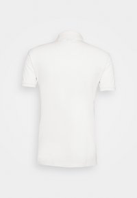 White polo shirt, short sleeves, classic collar, smooth cotton texture, simple design, no patterns or logos visible on the back.