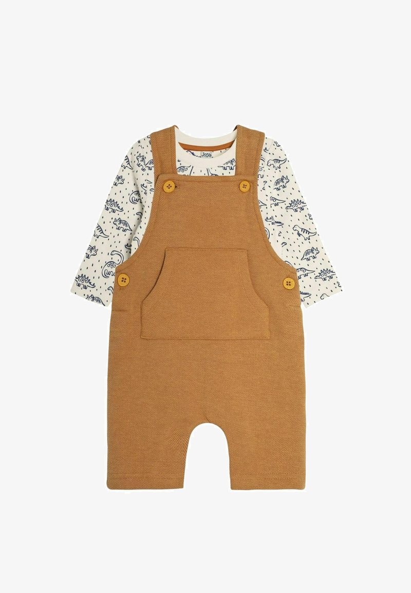 Pruunid kootud üleüldised, millel on reguleeritavad õlalihased, eesmine tasku ja kaks kollast nööpi. Allpool on valge pika varrukaga särk, millel on sinine dinosauruse mustrijoon.