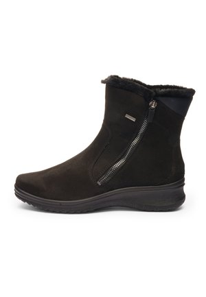 Black ankle boot with side zipper, fur lining, low wedge sole, and weather-resistant material.
